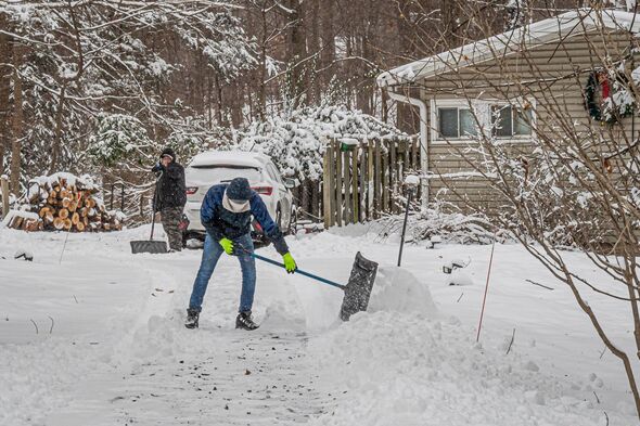 A man seen snow shoveling a driveway. Tappan got blanketed...