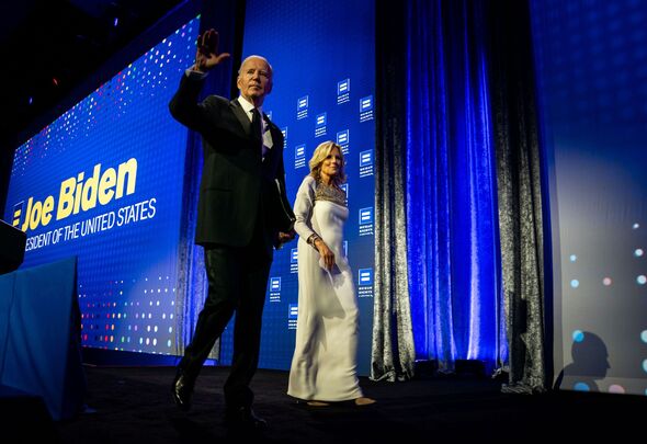 Joe Biden ushered off stage by Jill